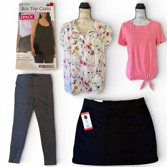 Collection of women's clothing including a floral cardigan, pink shirt, black skort, and gray pants on a white background.