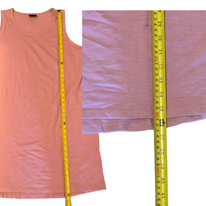 pink dress with a yellow measuring tape on a white background.