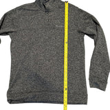 Gray sweater with a yellow measuring tape running vertically down the center on a white background