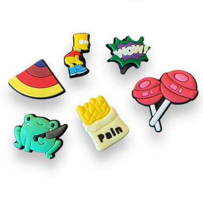 Set of colorful cartoon-themed shoe charms on a white background