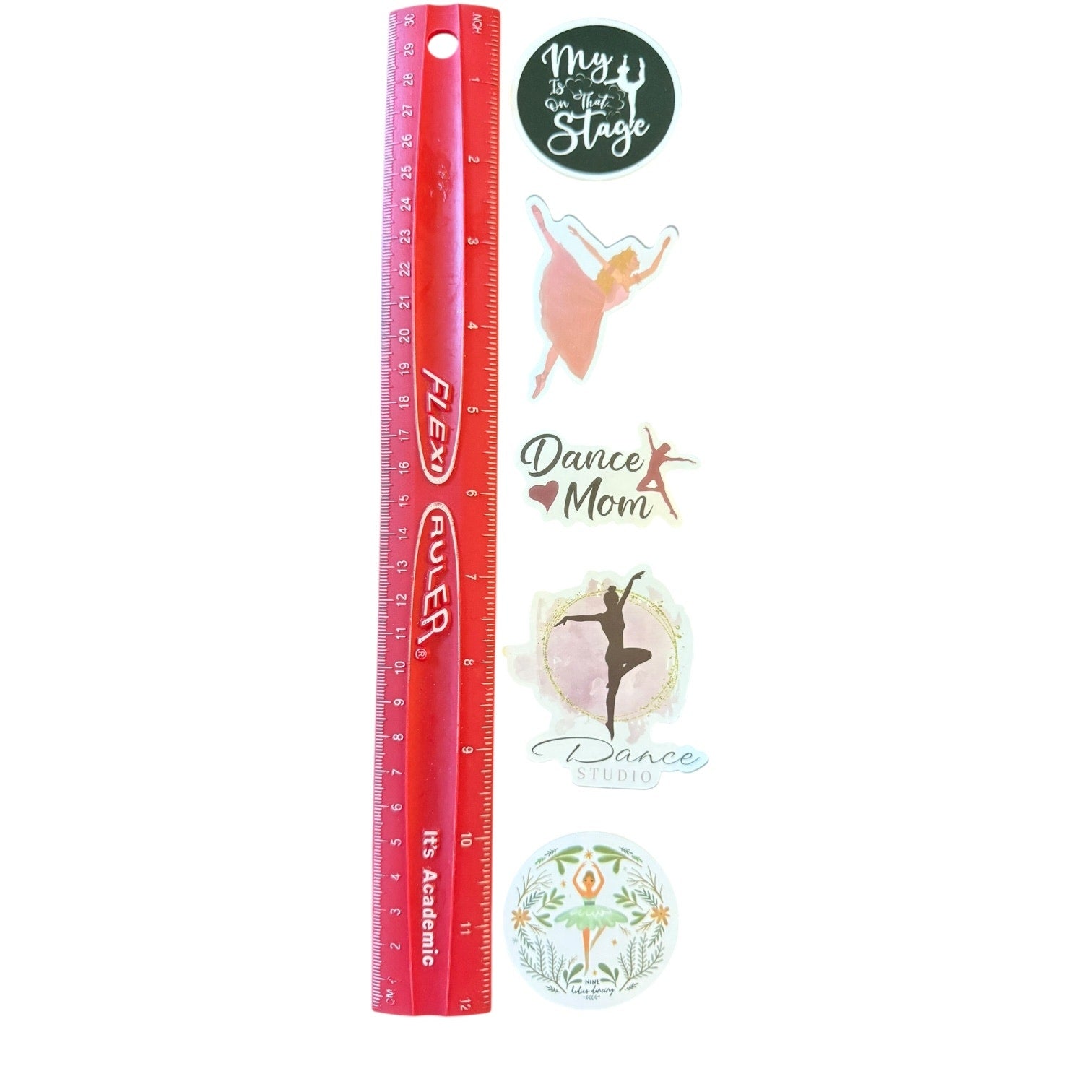 Red ruler with decorative stickers on a white background