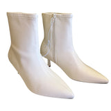Front side of Pair of white ankle boots on a white background