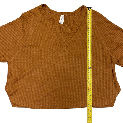 Brown textured shirt with a measuring tape on a white background