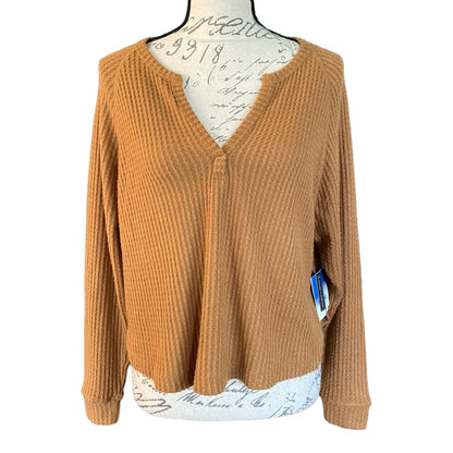 Front of brown top on a mannequin with a white background