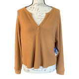 Front of brown top on a mannequin with a white background