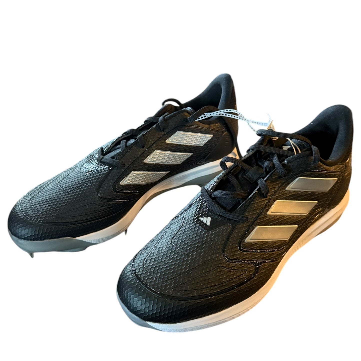 Black Adidas sports shoes with white soles on a white background front side