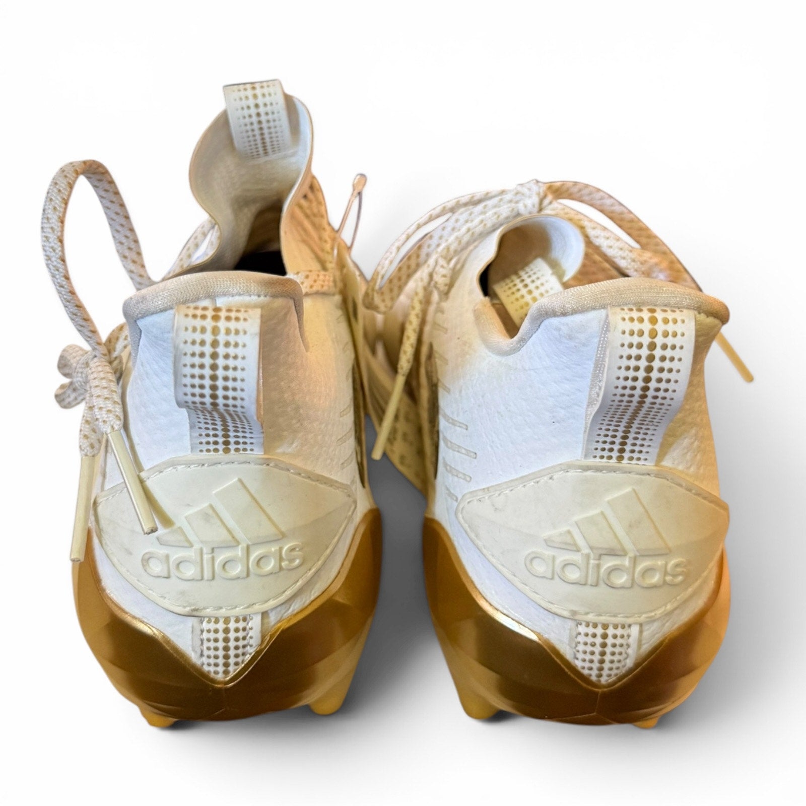 Pair of Adidas shoes with a white background