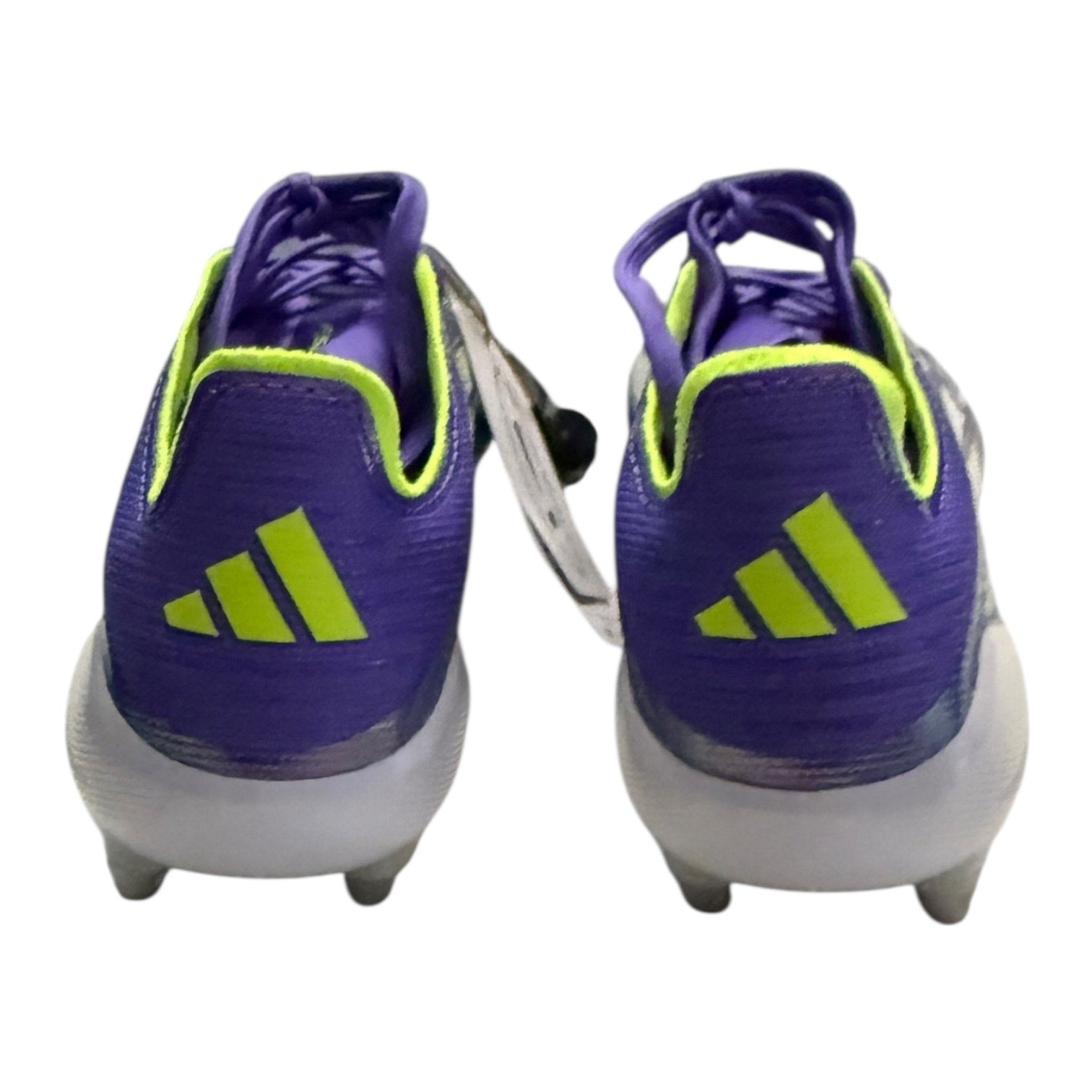Back of Purple soccer cleats with green accents on a white background