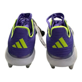 Back of Purple soccer cleats with green accents on a white background