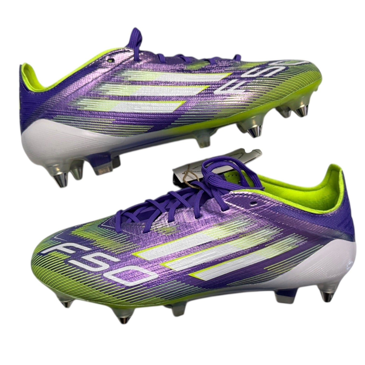 Side view of Purple and green soccer cleats with white accents on a white background