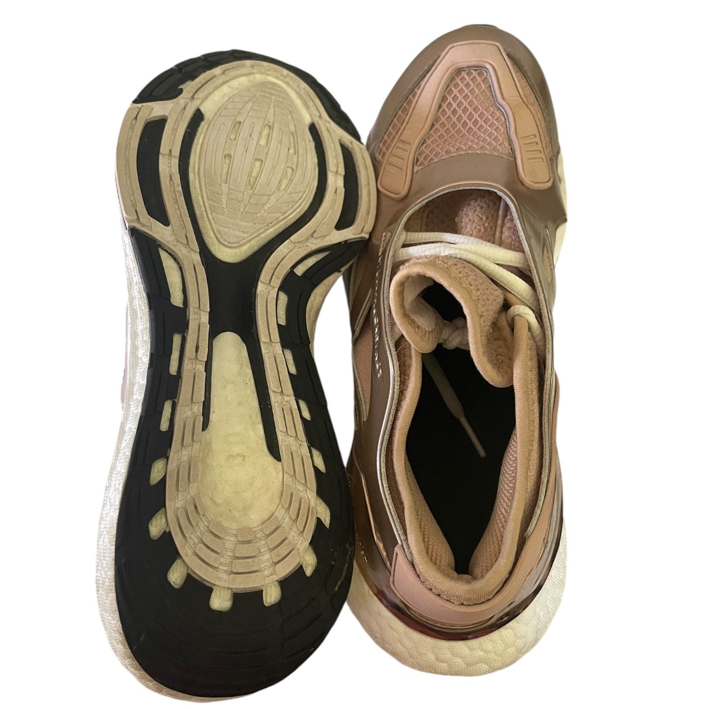 Top and bottom view of athletic shoes on a white background