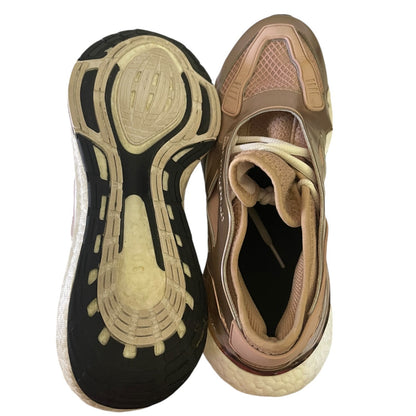 Top and bottom view of athletic shoes on a white background