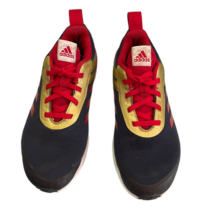 Pair of Adidas sneaker shoes with red laces and black  on a white background