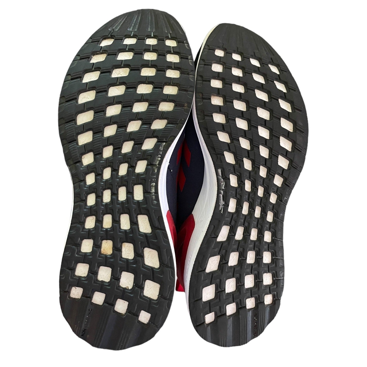 Close-up of a shoe sole with a textured pattern on a white background