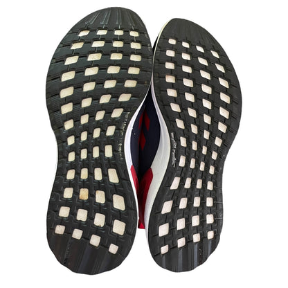 Close-up of a shoe sole with a textured pattern on a white background