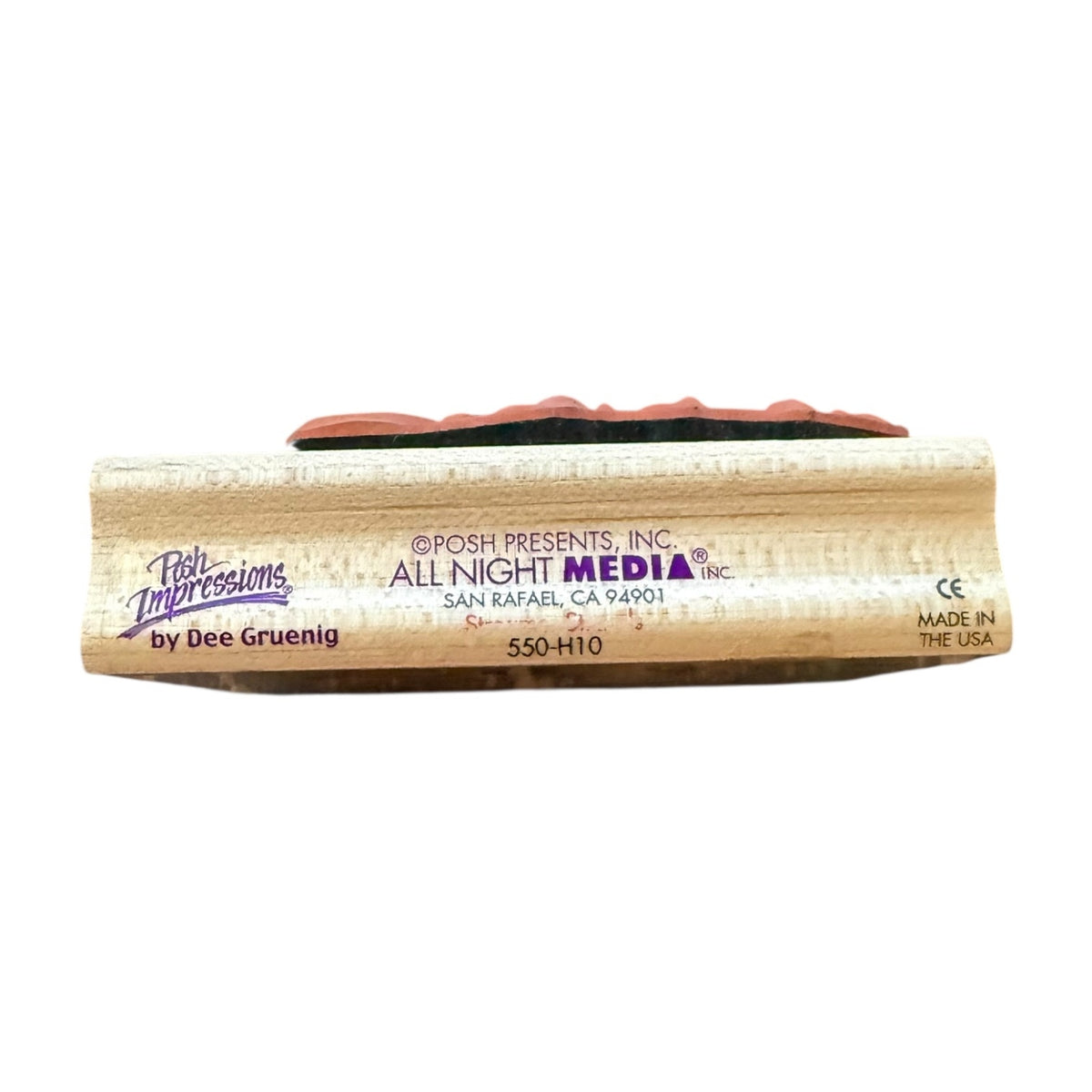 A wooden stamp block, branded with 'Posh Impressions by Dee Gruenig' and 'All Night Media Inc.' on the front.