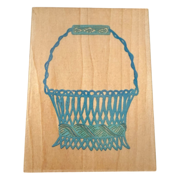 Teal basket design stamp on a wooden background