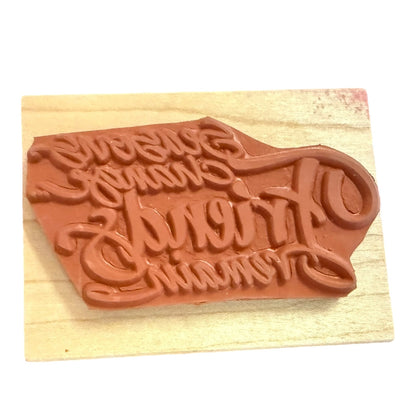 Textured stamp on a wooden block with a white background