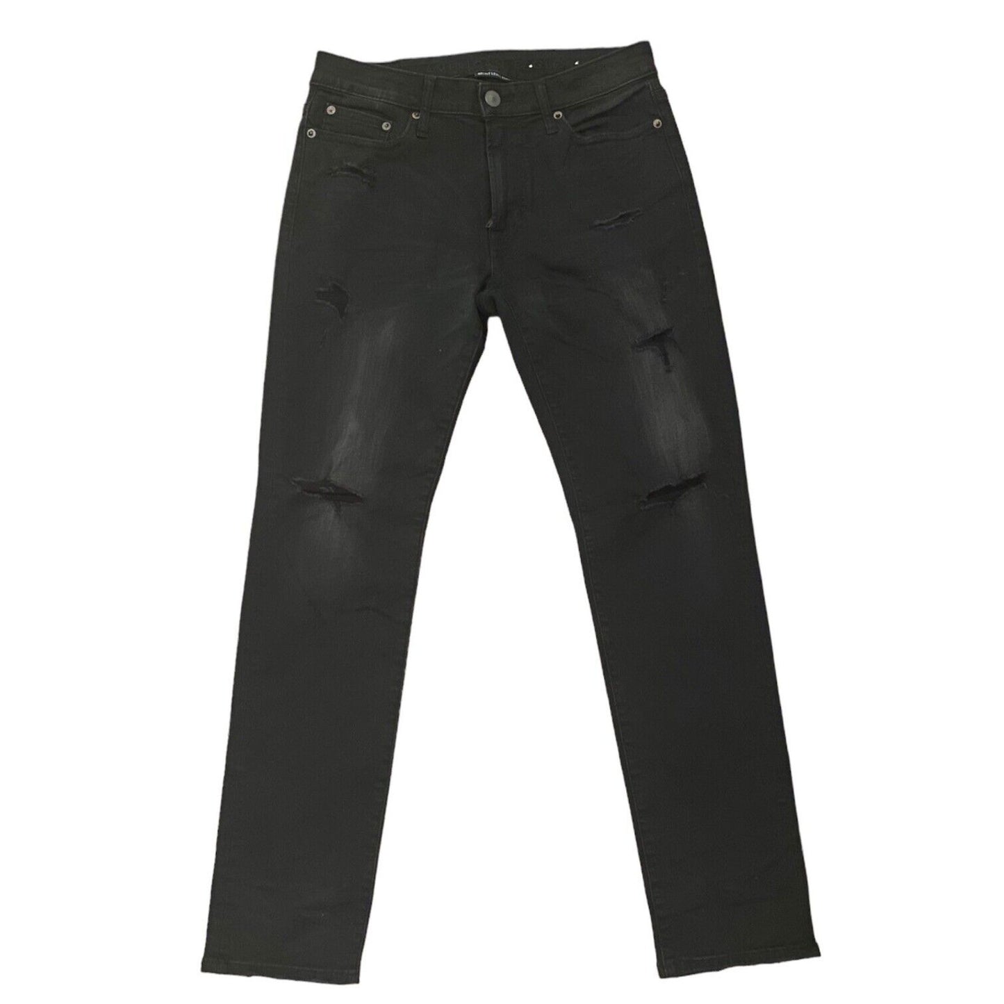 Front of black ripped jeans on a white background