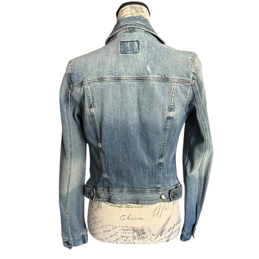 Back of Blue denim jacket on a mannequin with a white background