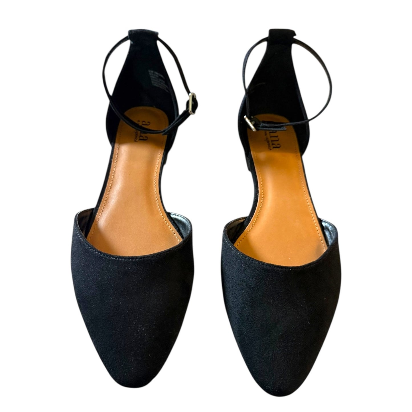 A pair of black pointed-toe flats with a tan insole, shown from a top-down view on a white background.