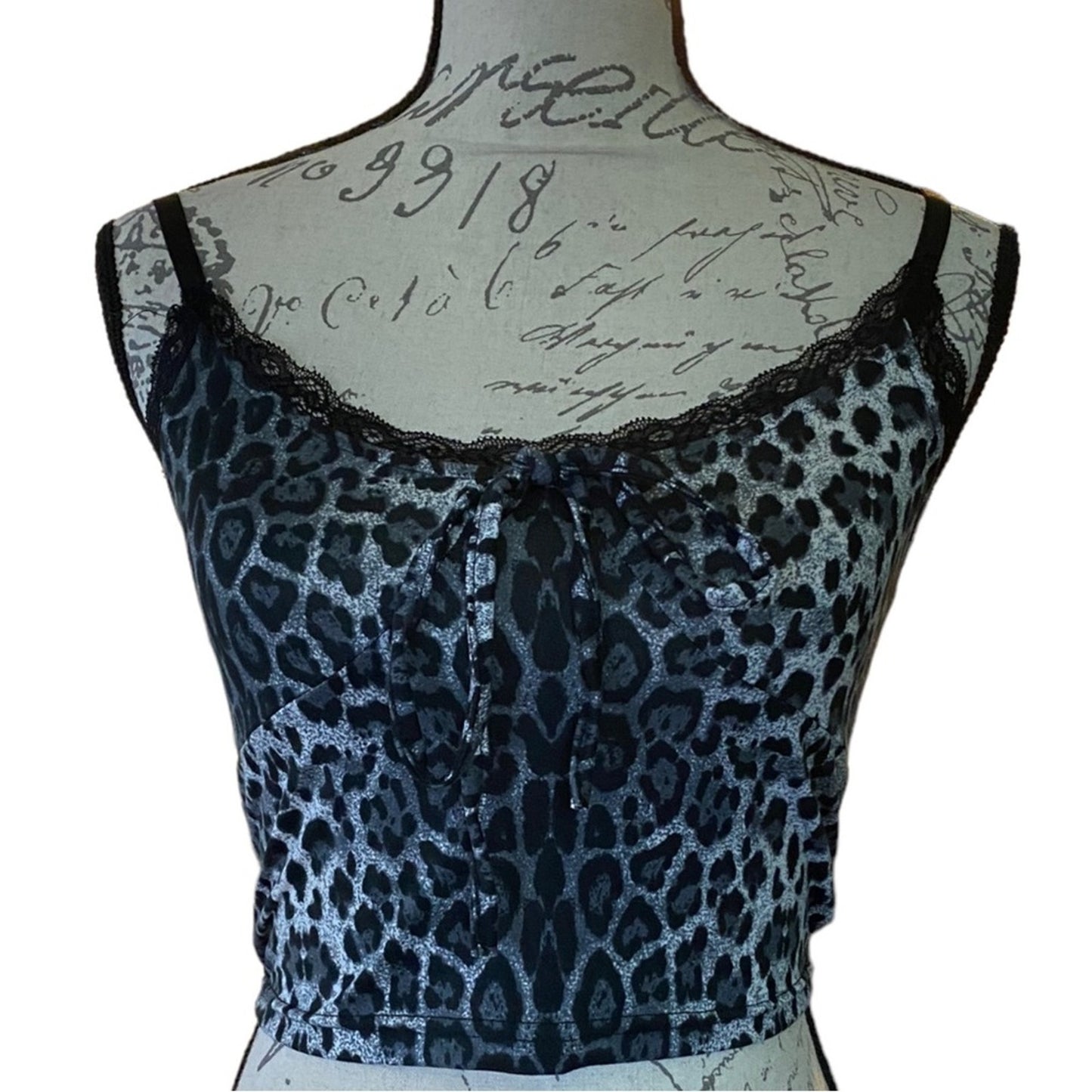 Front of Leopard print top on a mannequin with a white background