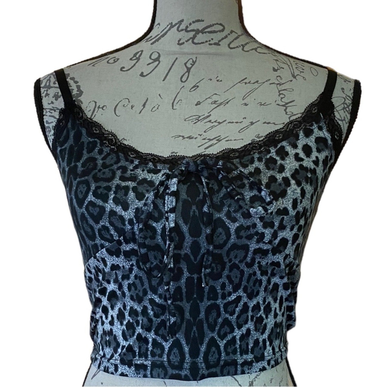 Front of Leopard print top on a mannequin with a white background