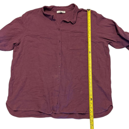 Purple shirt with a measuring tape on a white background