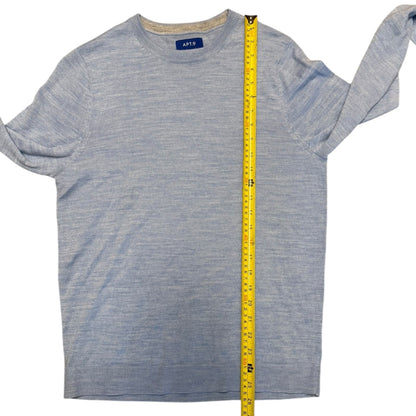 Blue sweater with a measuring tape on a white background