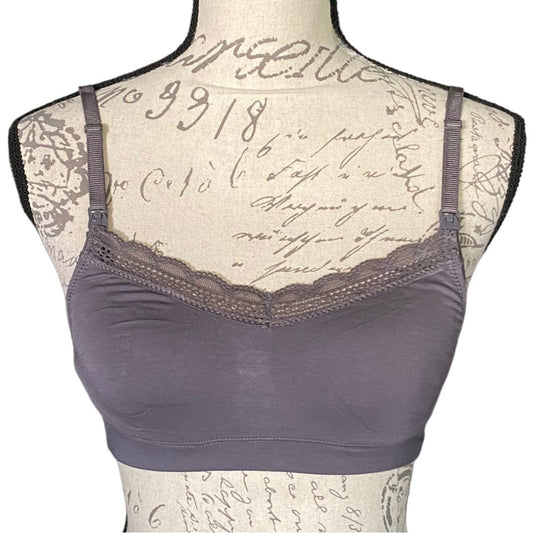 Front of purple bra on a mannequin with lace detailing against a script background
