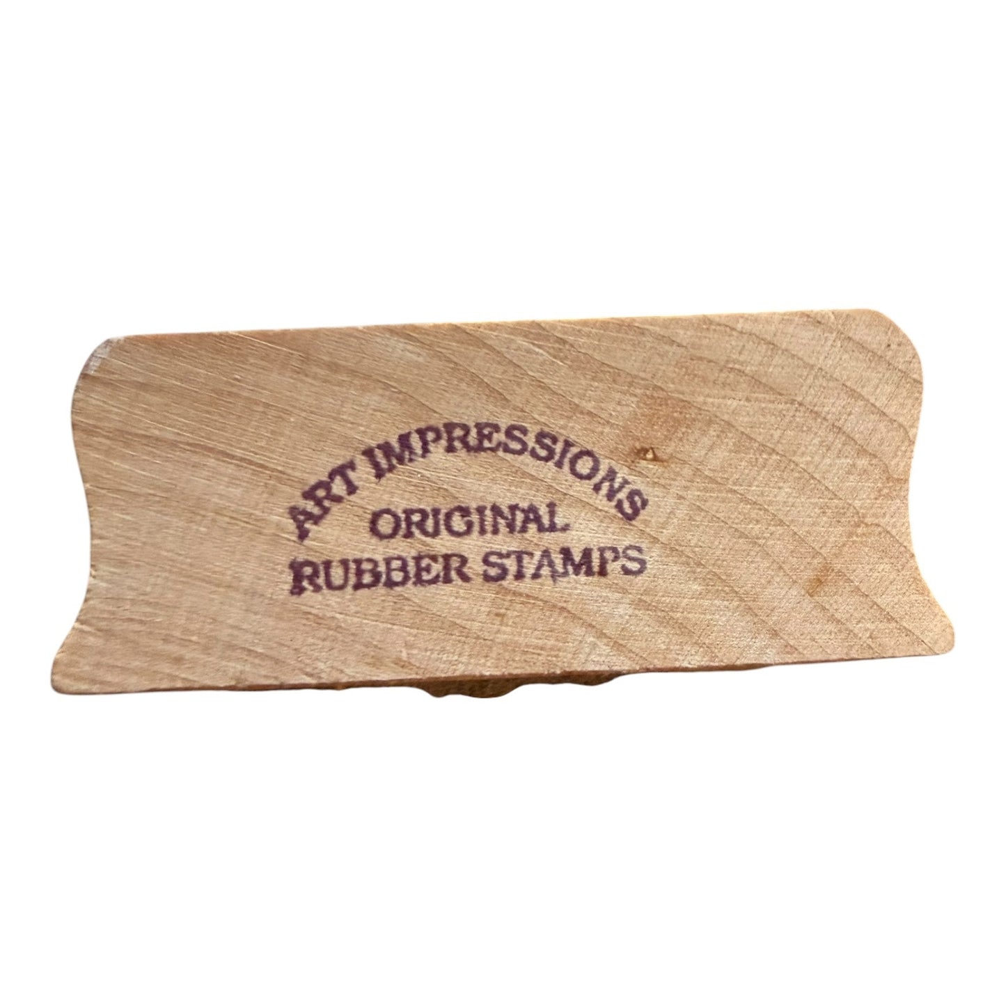 Wooden stamp block with 'Art Impressions Original Rubber Stamps' text on a white background