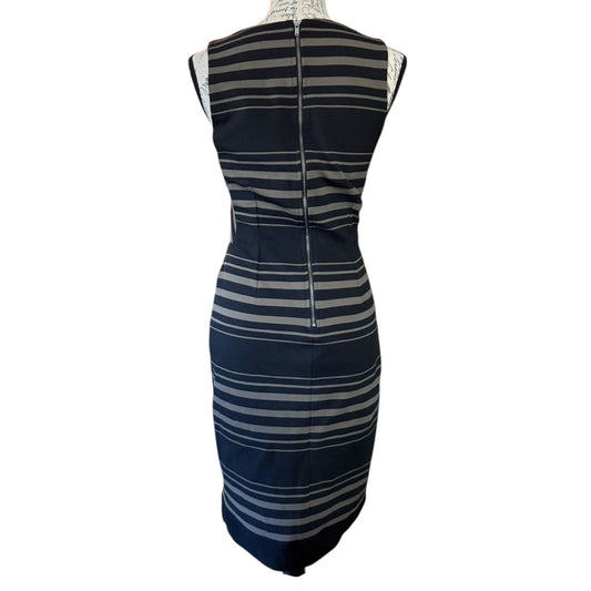 Striped dress on a mannequin against a white background