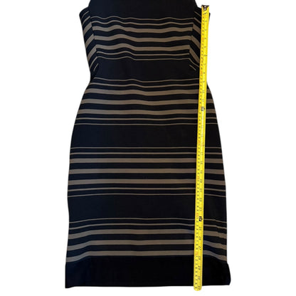 Striped dress with a measuring tape on a white background