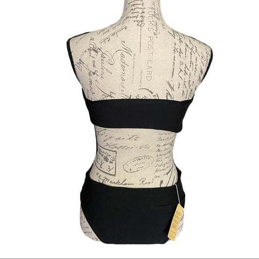 Mannequin wearing a black bikini visible brand tag.