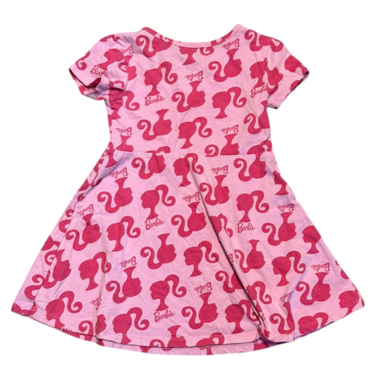 Back of Pink dress with Barbie logo pattern on a white background