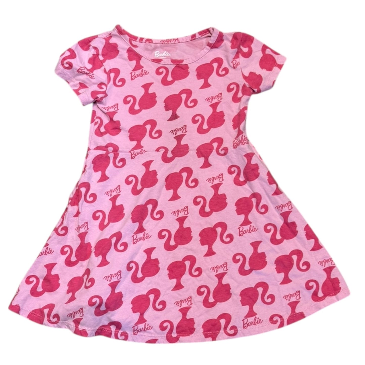 Front of Pink dress with Barbie logo pattern on a white background