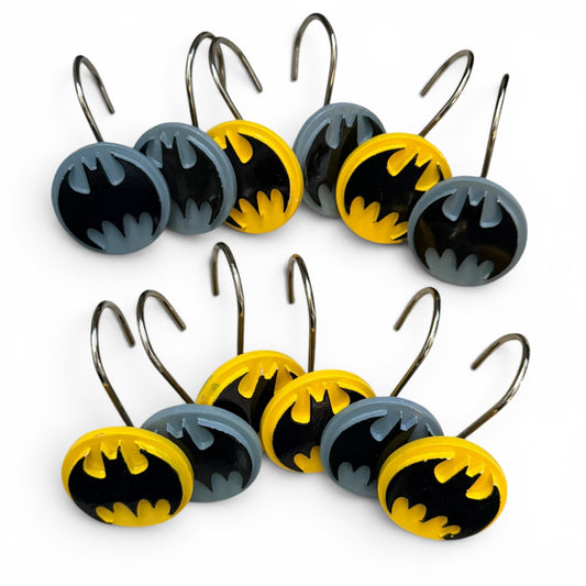 Set of Batman-themed shower curtain hooks on a white background
