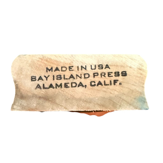 Wooden stamp with 'Made in USA, Bay Island Press, Alameda, Calif.' text on a white background