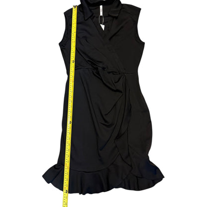 A black sleeveless wrap-style dress with a ruffled hem, shown against a white background with a yellow measuring tape running vertically along the left side for size reference.