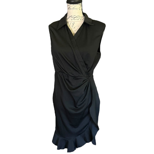 A sleeveless black faux wrap-style dress with a collar and gathered ruffle detail at the waist, displayed on a dress form against a plain white background.