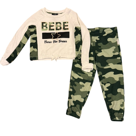 Children's outfit with camouflage long-sleeve shirt and pants on a white background