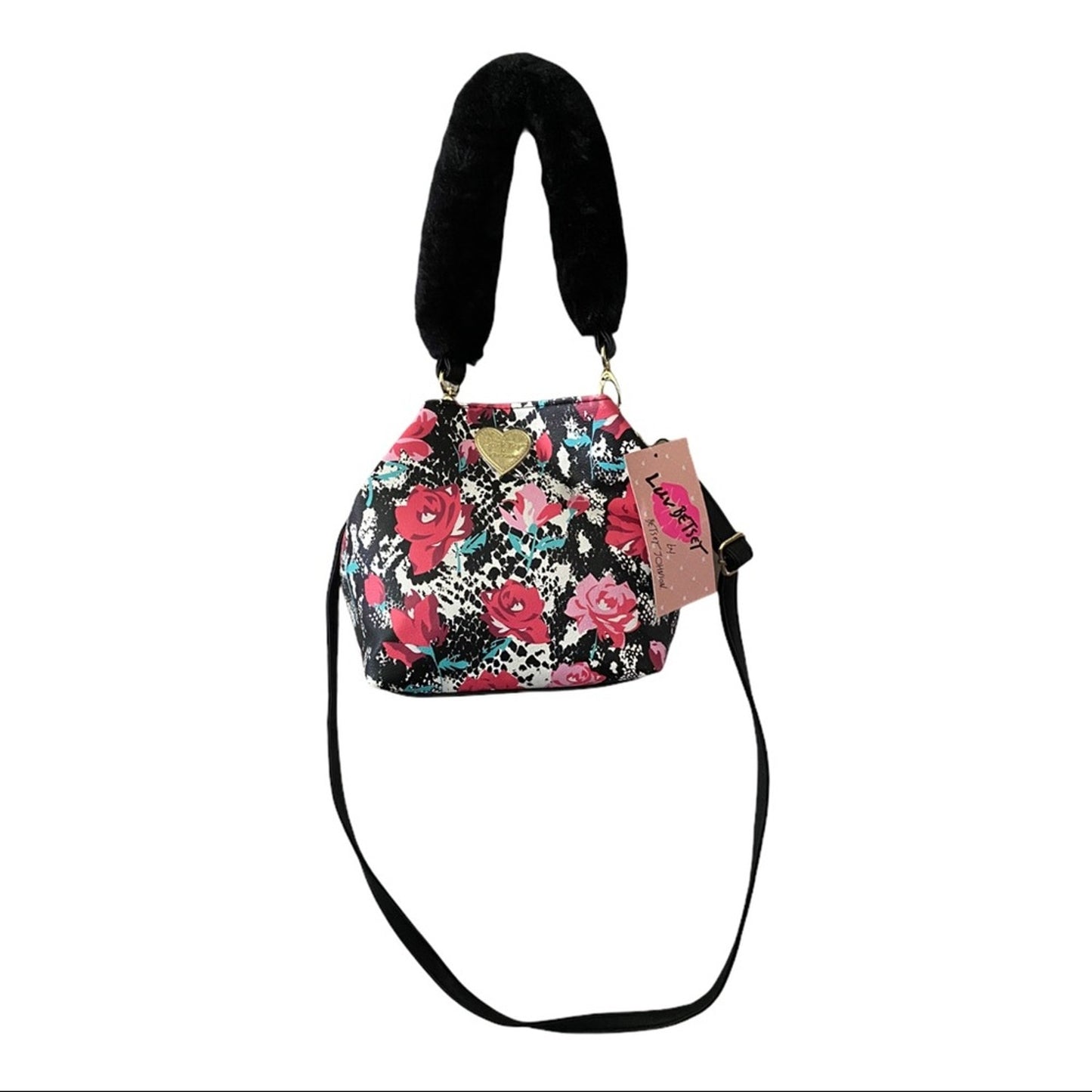 A small floral-patterned handbag with a black faux-fur handle, a black shoulder strap, and a pink brand tag.