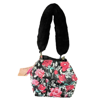 A small bucket-style shoulder bag with a black faux-fur handle, featuring a black, white, and pink floral rose pattern on the body, with a pink hangtag attached.