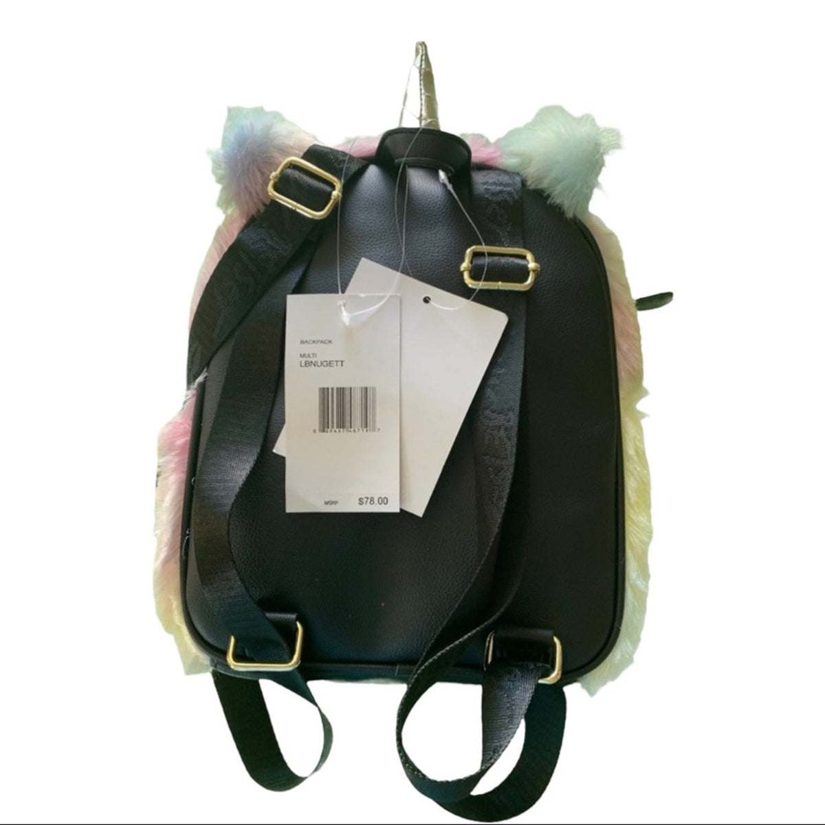 Back of black faux-leather unicorn backpack with pastel pink, green, and yellow fluffy front, a silver horn, shown with retail tags on a white background.