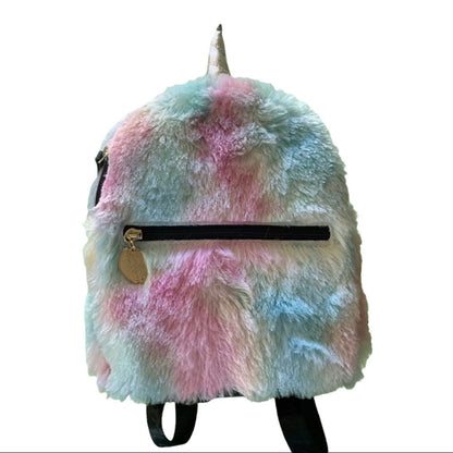 A fuzzy unicorn-themed backpack with pastel pink, blue, and white mottled fur, a silver horn, and black straps on a white background.
