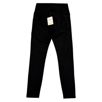 Back of Black leggings with a tag on a white background