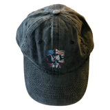 Dark denim cap with embroidered design on a white background