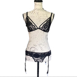 Front of Black lace lingerie set on a mannequin against a white background