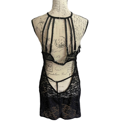 Black lace lingerie set on a mannequin with a vintage-style background
