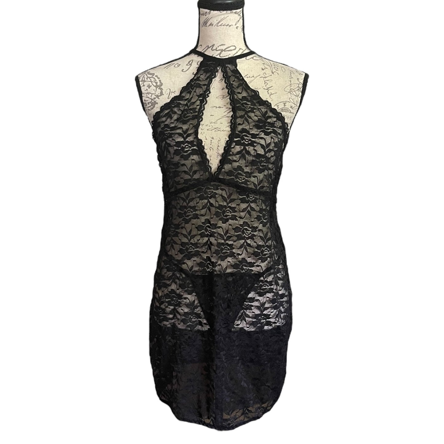 Black lace lingerie set on a mannequin against a white background